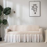 housses jupe extensibles blanc cassé pour fauteuil