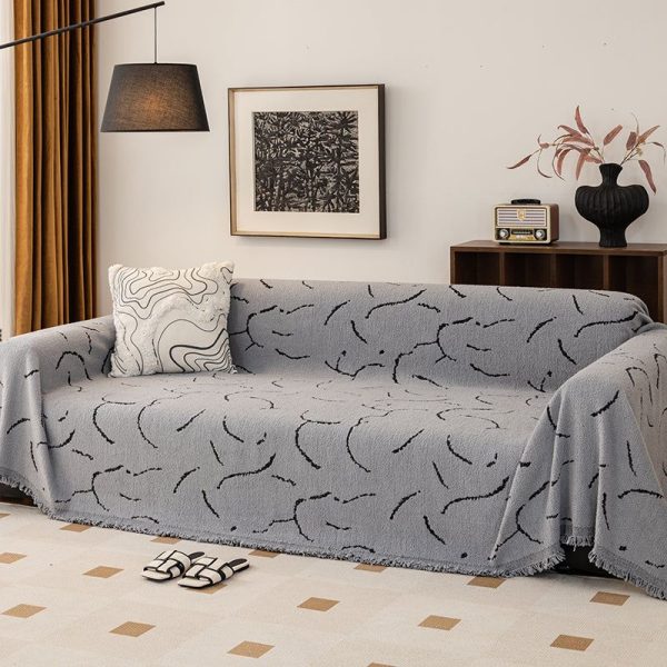 jeté de canapé tissé courbes gris