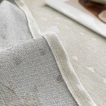 jeté décoratif écru tissé éclaboussures