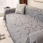 jeté décoratif gris tissé