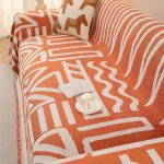 jeté décoratif orange tissé