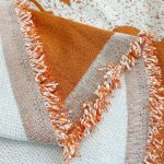 plaid orange tissé pour canapé