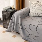 plaide tissé courbes gris pour canapé