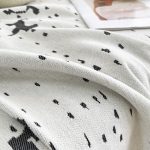 plaide tissé éclaboussures noires